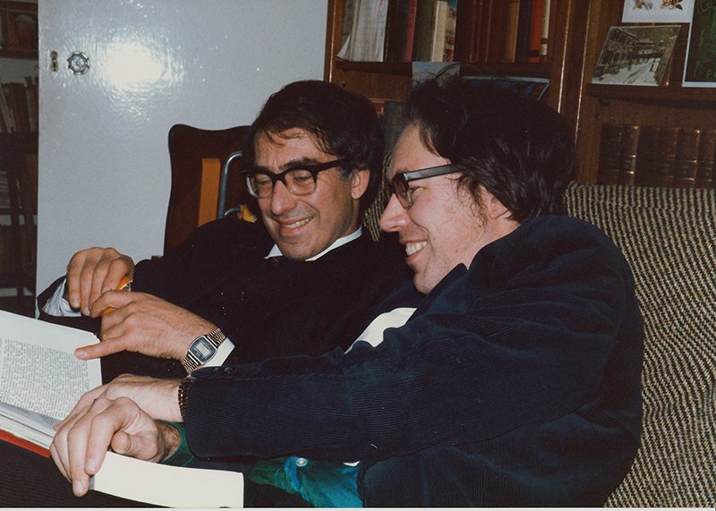 Thomas and Christopher Braun in 1984, looking at an illustrated photocopied version of an old history of part of the family