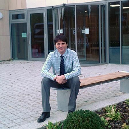 Dr Micah Muscolino outside the Dickson Poon University of Oxford China Centre Building
