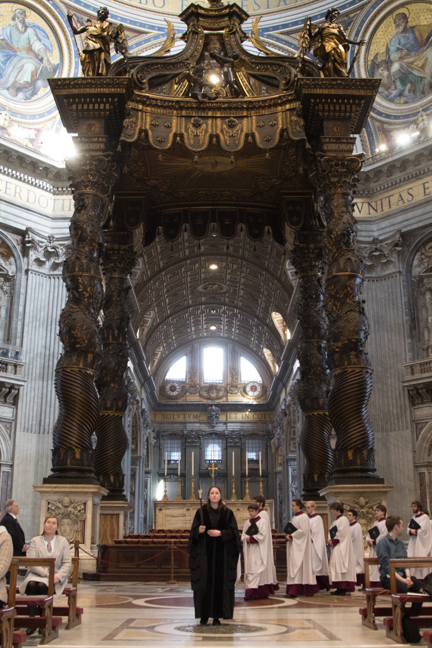 The Verger of Merton College, Leah Stead, leads the entrance procession for Anglican Evensong at the altar of the Chair of St Peter in St Peter’s Basilica at the Vatican