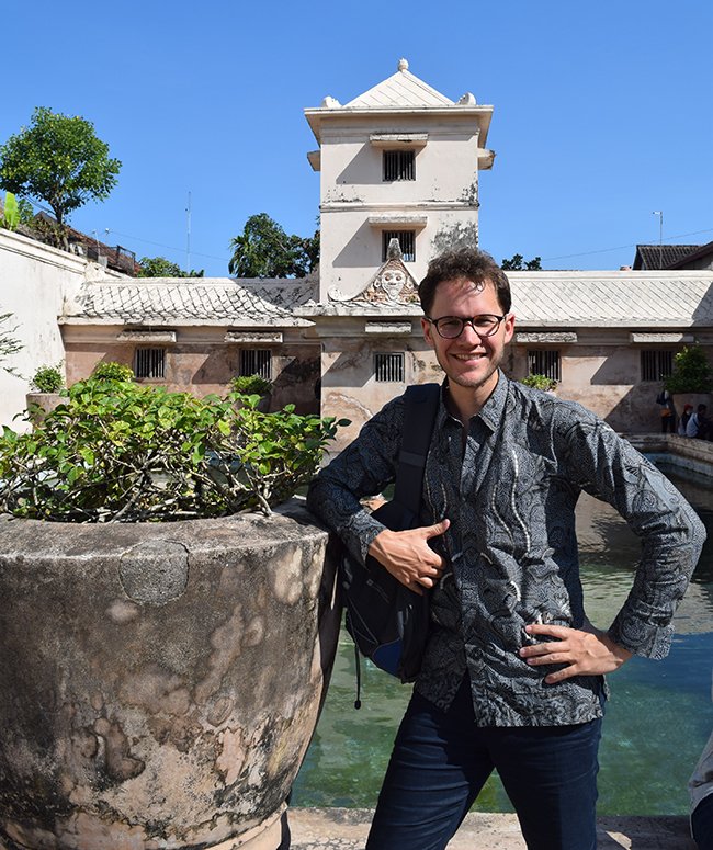 Yuri wearing his grandfather's batik, in front of the water palace of Yogyakarta's sultan, where his great-great-grandmother served as a raden-ayu, or lady-in-waiting - Photo: © Yuri van Nieuwkerk