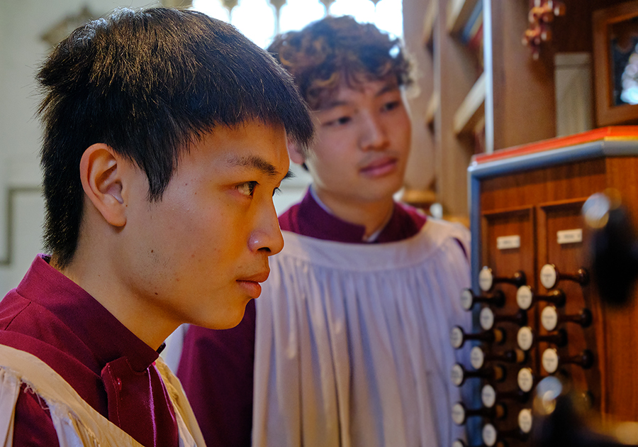 Owen Chan (in the foreground) playing the Dobson Organ