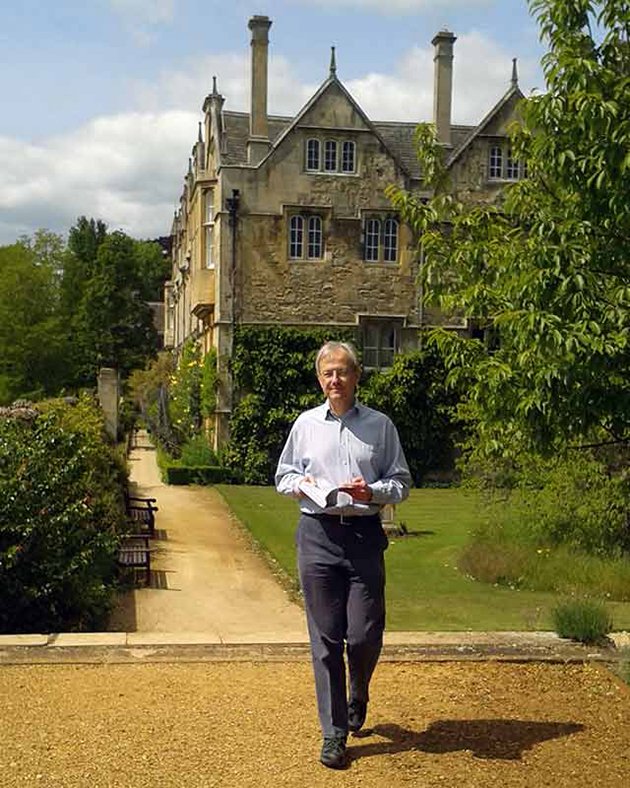 Professor Steven Gunn walking 12.64 times round the College garden while reading a book about Queen Elizabeth I