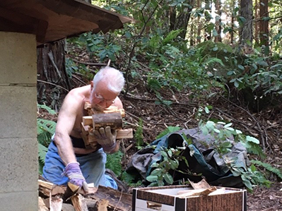 Tony carrying firewood chunks