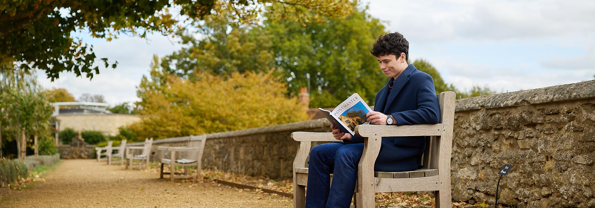 Student Reading Postmaster & The Merton Record in Fellows' Garden - Photo: © Ian Wallman www.ianwallman.com