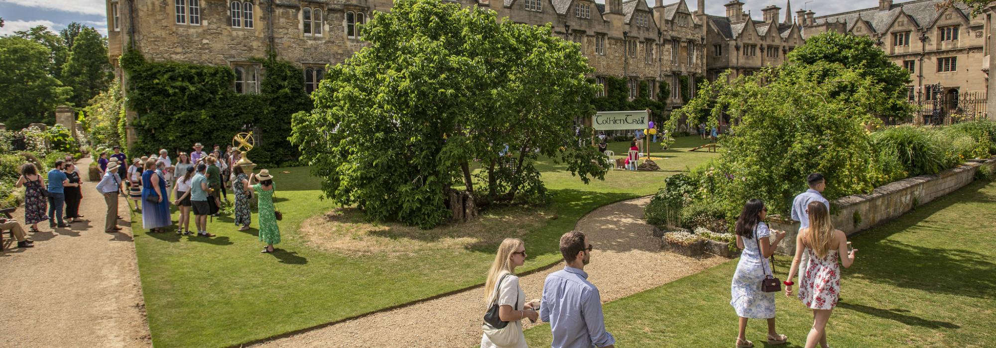 Alumni walking in the gardens