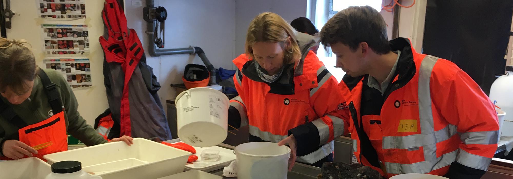 Oliver processes material with Dr Laura Robinson (Reader in Geochemistry, University of Bristol) gathered from an Agassiz trawl. [© Melanie Mackenzie]