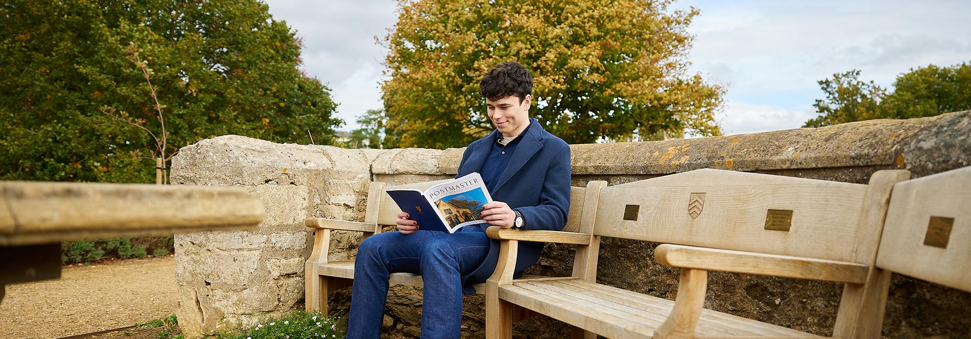 Student reading Postmaster & The Merton Record - Photo: © Ian Wallman www.ianwallman.com