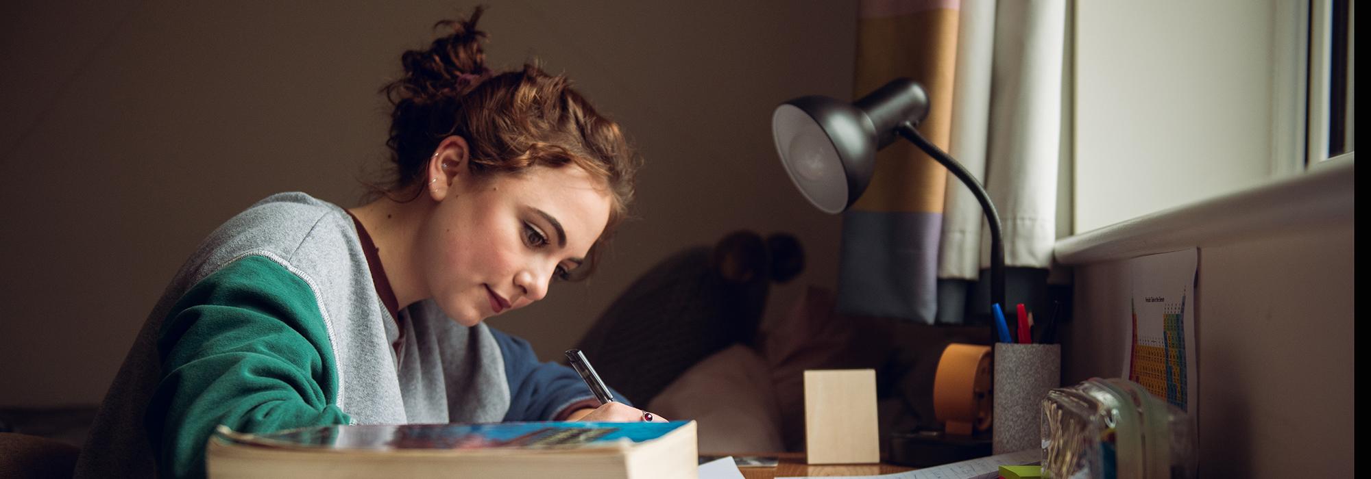 A student preparing for a tutorial in her room - Photo © John Cairns - www.johncairns.co.uk