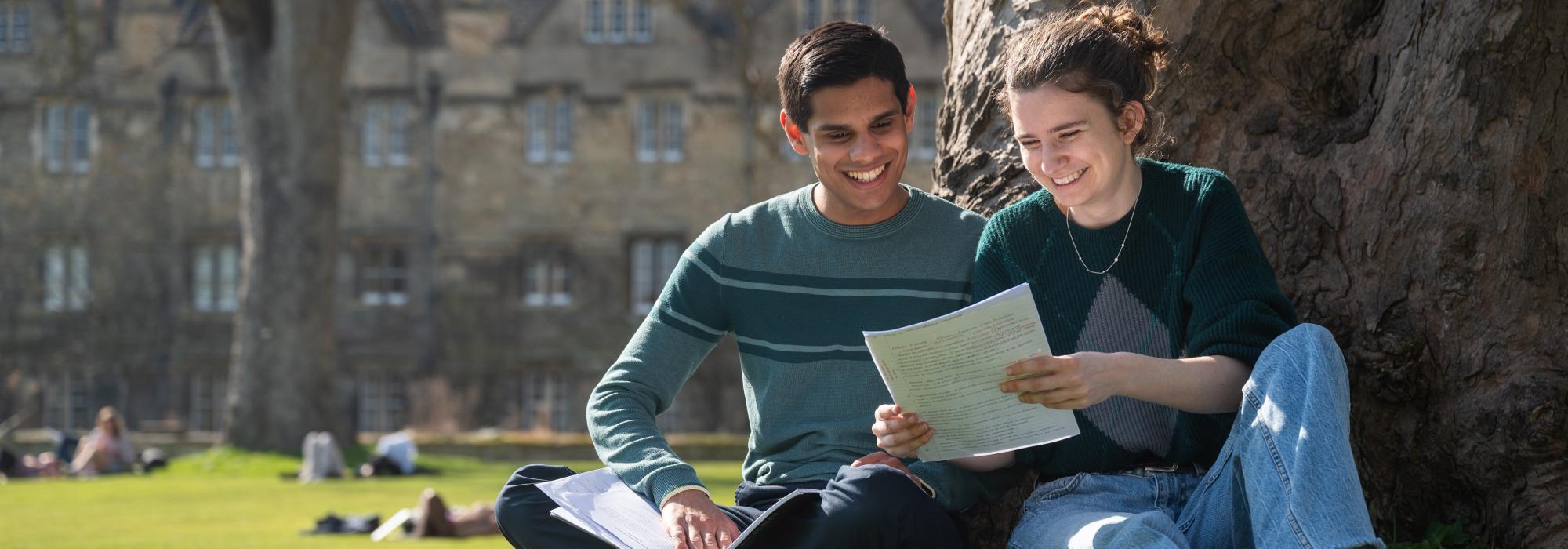 Two students reading together