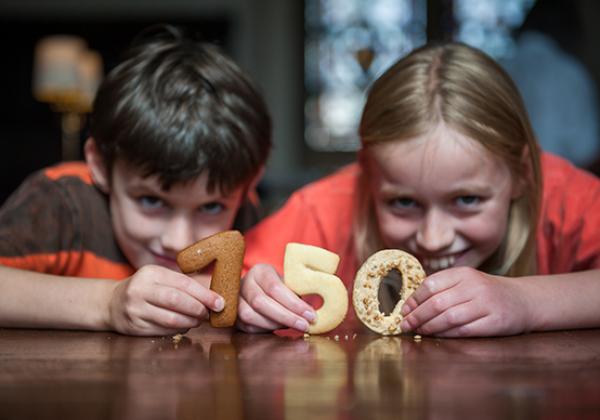 Two children with pastry numbers - Photo: © John Cairns - www.johncairns.co.uk