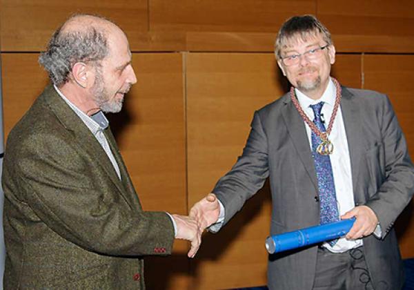 Boris Zilber receives his award from Professor Terry Lyons, LMS President - © London Mathematical Society