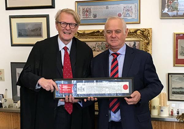 The Warden of Merton College, Sir Martin Taylor FRS, is presented with the The Copy of the Freedom by the Clerk of the Chamberlain’s Court, Mr Murray Craig.