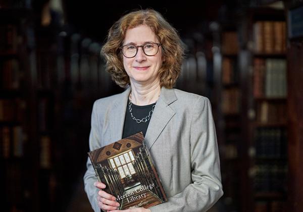 Dr Julia Walworth with a copy of her new book, a history of Merton College Library, in the Upper Library - Photo: © Ian Wallman - www.ianwallman.com