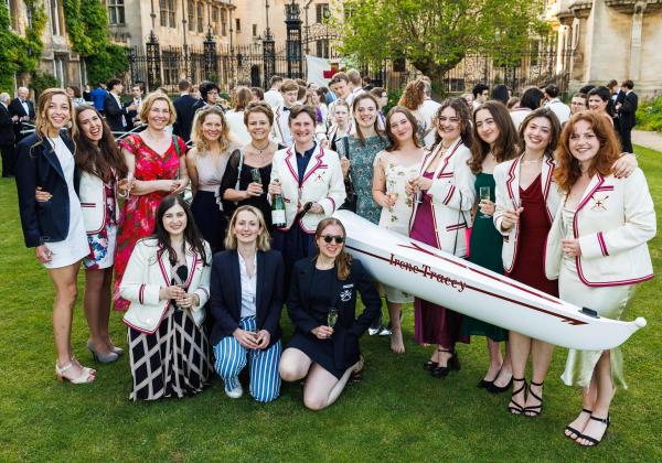 Merton women rowers gathered around the new shell, the Irene Tracey