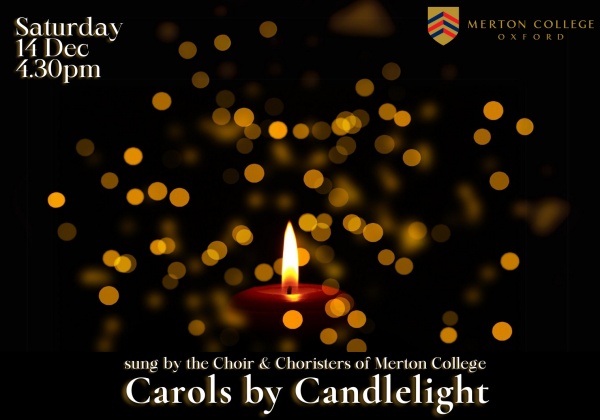 Candle lit in a sea of gold lights