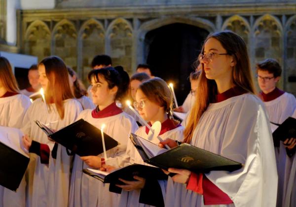 Epiphany Carols Choir singing in Chapel with handheld candles