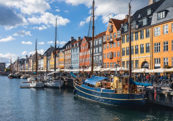 Colourful waterfront houses with sailboats in Copenhagen