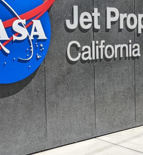 Khadija Sarguroh stood in fron of the NASA sign
