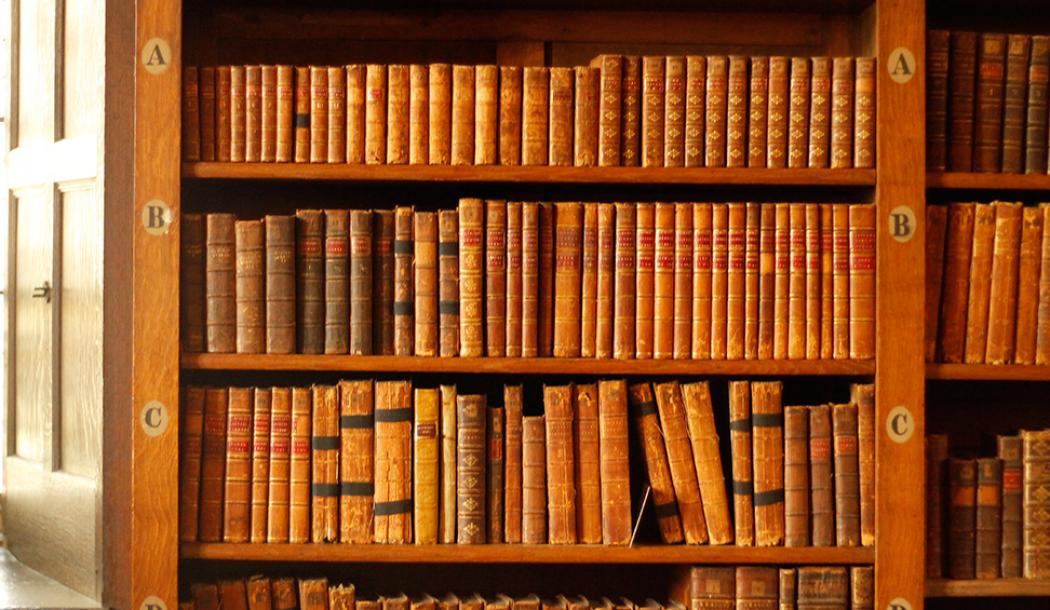 Books shelved in the Upper Library