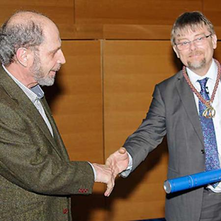 Boris Zilber receives his award from Professor Terry Lyons, LMS President - © London Mathematical Society Boris Zilber receives his award from Professor Terry Lyons, LMS President - © London Mathematical Society