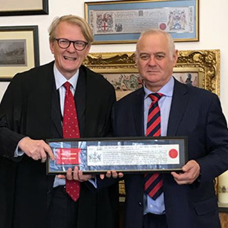 The Warden of Merton College, Sir Martin Taylor FRS, is presented with the The Copy of the Freedom by the Clerk of the Chamberlain’s Court, Mr Murray Craig.