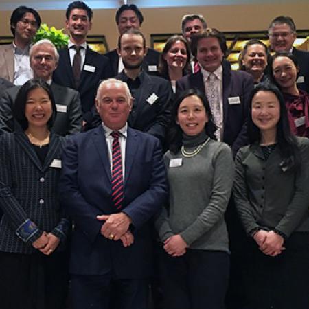 The Warden, Sir Martin Taylor, with dinner guests at La Colline, Tokyo