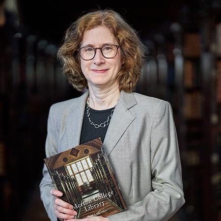 Dr Julia Walworth with a copy of her new book, a history of Merton College Library, in the Upper Library - Photo: © Ian Wallman - www.ianwallman.com