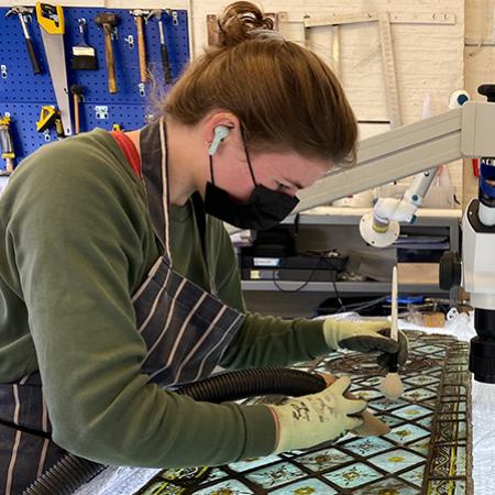 A conservator at York Glaziers Trust working on the Upper Library's medieval stained glass A conservator at York Glaziers Trust working on the Upper Library's medieval stained glass