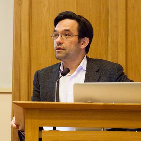 Professor Alex Schekochihin at the lectern in the TS Eliot Lecture Theatre, Merton College