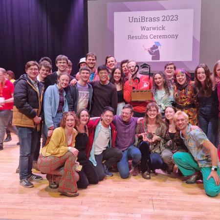 Oxford University Brass Band with the Shield award at the 2023 University Brass Band Championships of Great Britain and Northern Ireland 