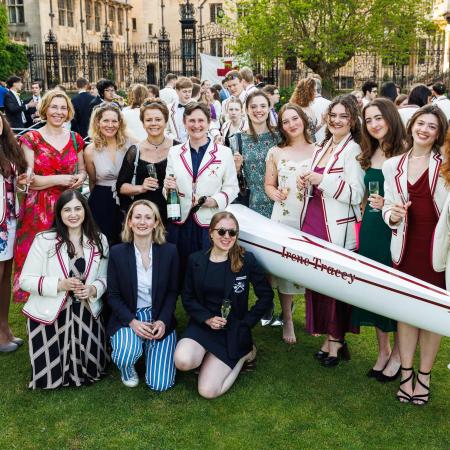 Merton women rowers and the new shell, the Irene Tracey Merton women rowers gathered around the new shell, the Irene Tracey