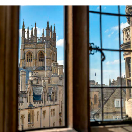 chapel tower viewed through a window