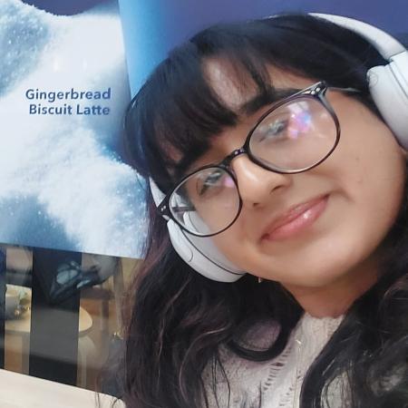 Anisha Mohammed young woman with headphones